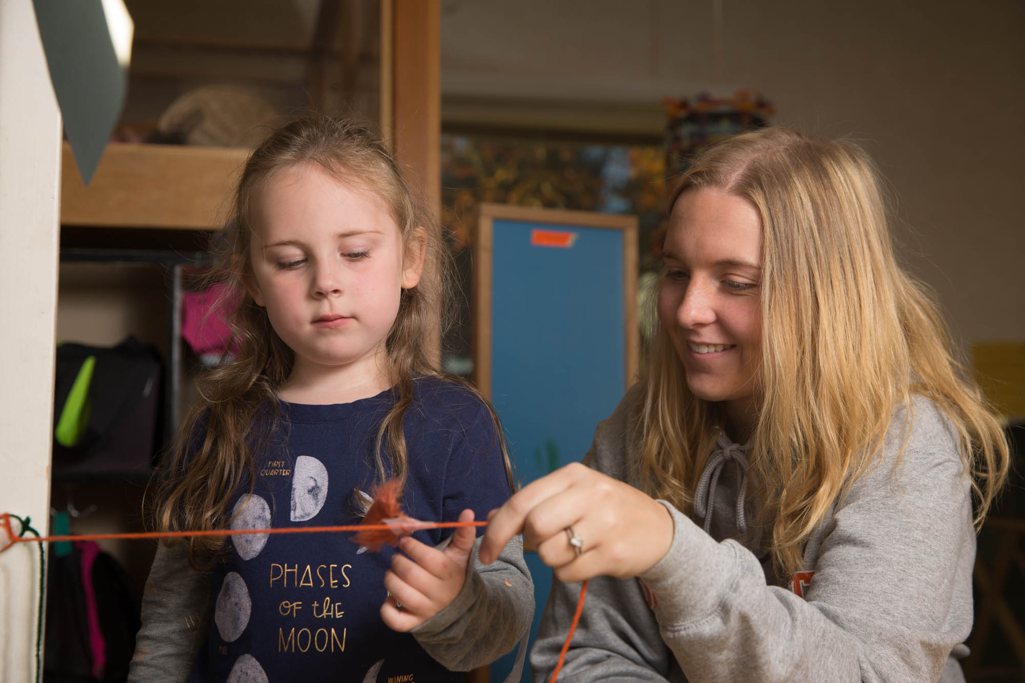 Teacher working with her child in the classroom